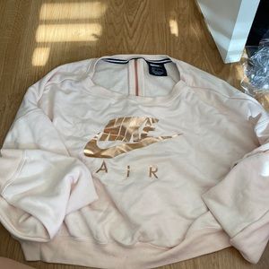 Pink nike cropped crew neck with a zippered down back
